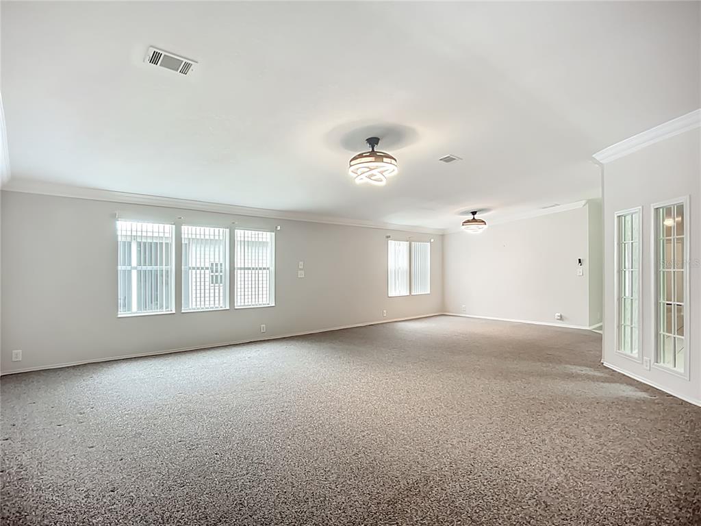 8307 Nancy Lane Ellenton, FL 34222 - Photo 10 of 56 a view of empty room with windows