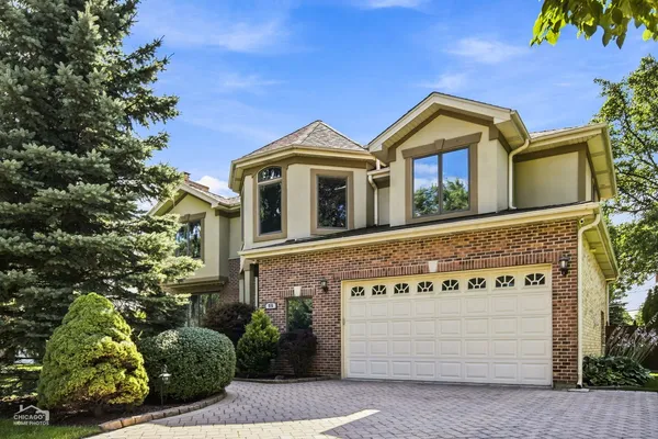 a front view of a house with a garage