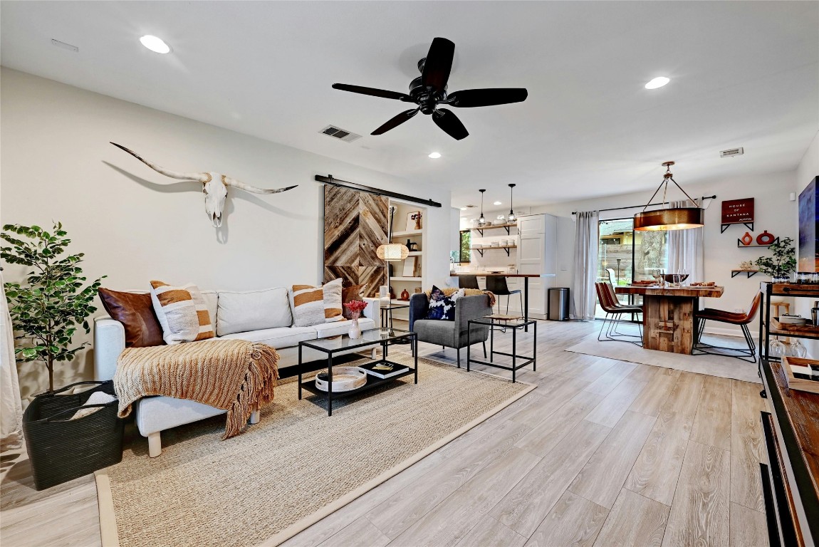 2511 Friar Tuck Lane Austin, TX 78704 - Photo 1 of 21 a living room with furniture and a wooden floor