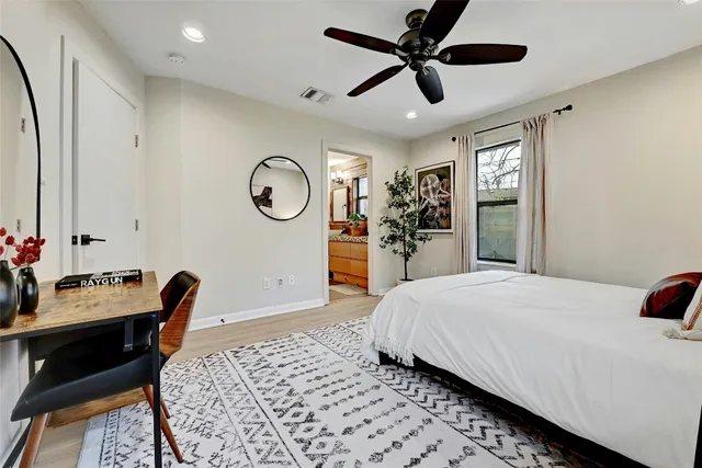 a bedroom with bed and a chair