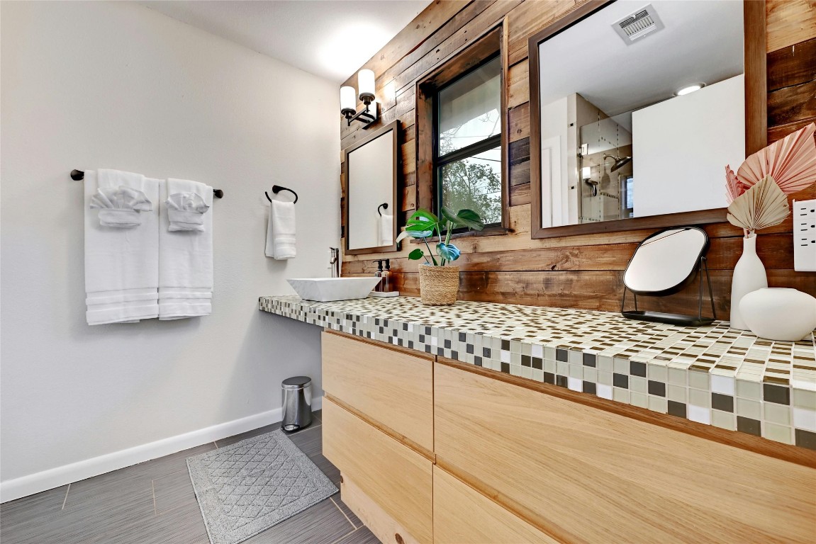 2511 Friar Tuck Lane Austin, TX 78704 - Photo 14 of 21 a living room with granite countertop furniture a flat screen tv and a large window