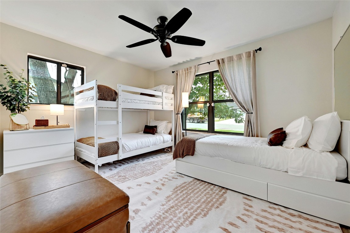 2511 Friar Tuck Lane Austin, TX 78704 - Photo 16 of 21 a living room with a bed furniture and a large window