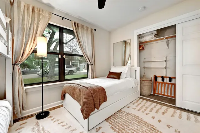 a bedroom with a bed and a window