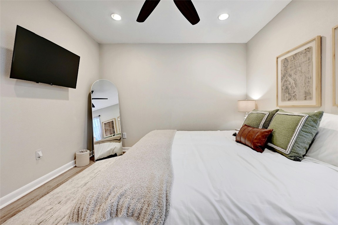 2511 Friar Tuck Lane Austin, TX 78704 - Photo 20 of 21 a bedroom with a bed and a flat screen tv