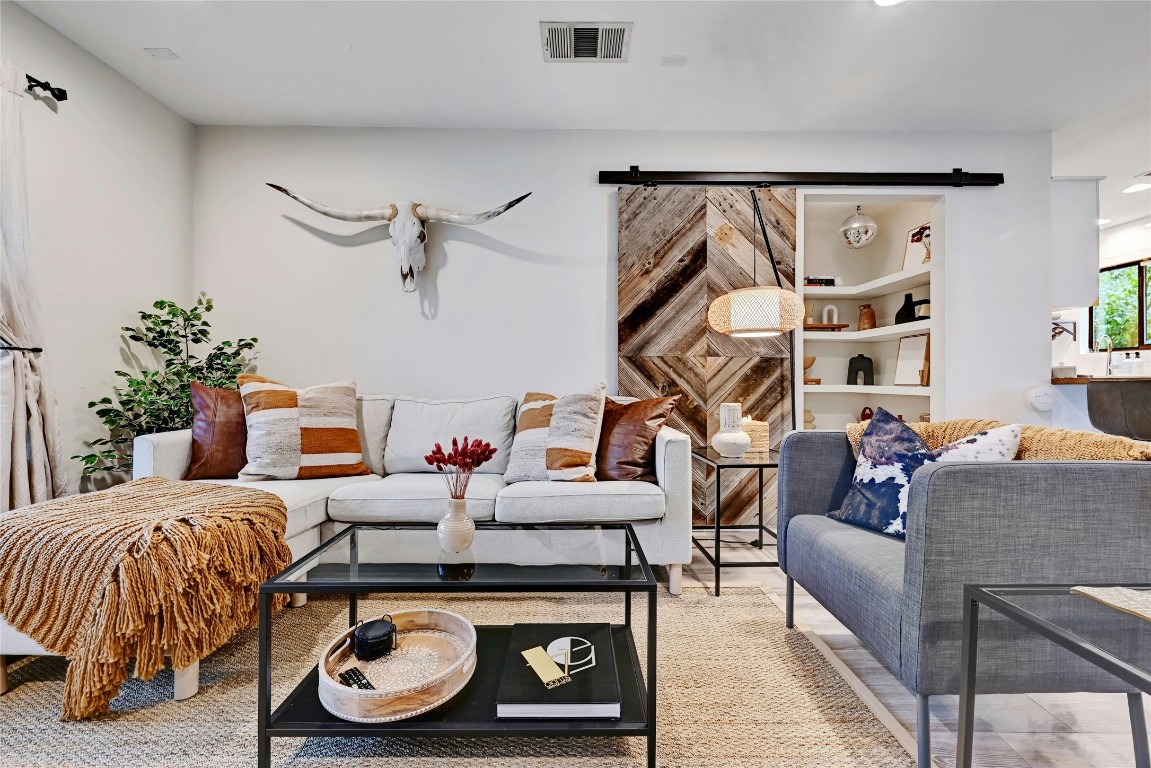2511 Friar Tuck Lane Austin, TX 78704 - Photo 5 of 21 a living room with furniture and a flat screen tv
