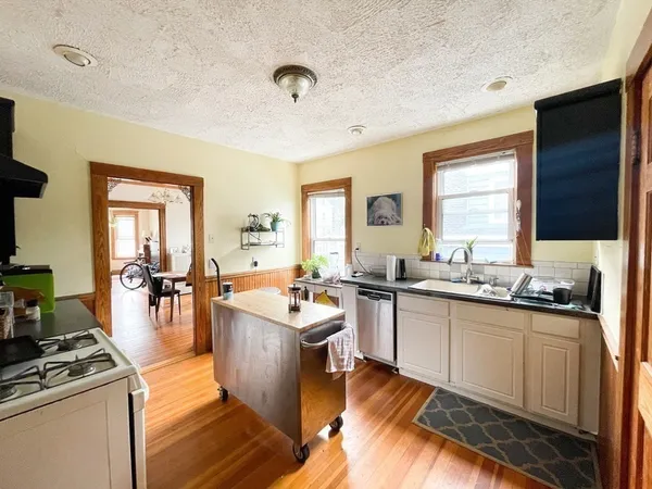 a kitchen with lots of counter top space and dining table