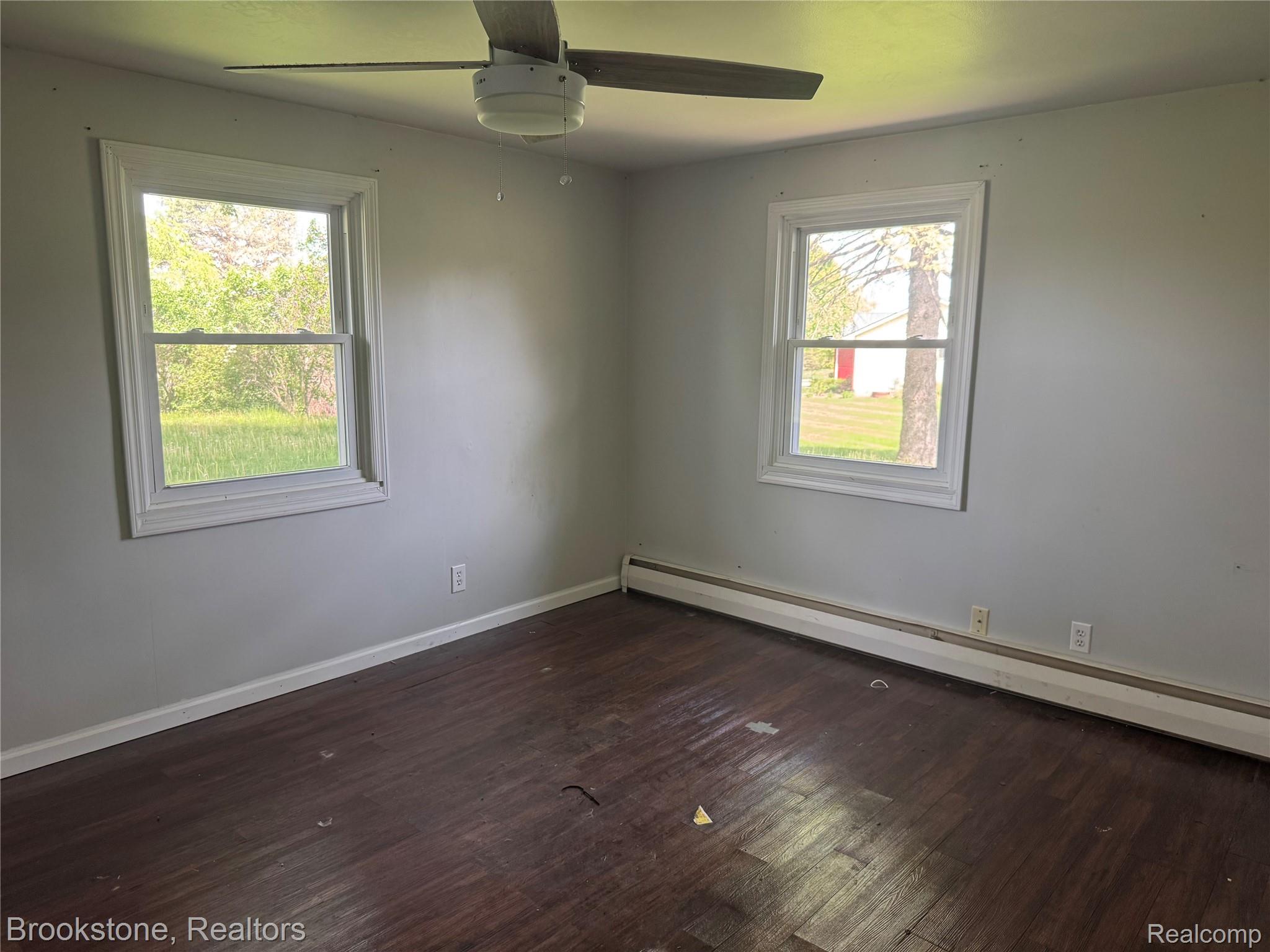 3055 Atlas Road Davison, MI 48423 - Photo 3 of 13 Interior room with dark wood-finish flooring and light gray painted walls