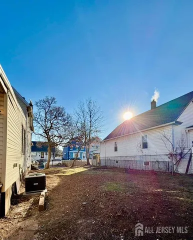 a view of a back yard of the house