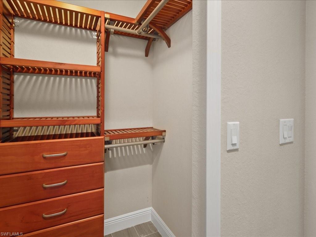 9719 Acqua Court, Unit 218 Naples, FL 34113 - Photo 12 of 23 View of walk in closet
