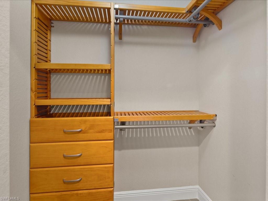 9719 Acqua Court, Unit 218 Naples, FL 34113 - Photo 13 of 23 View of walk in closet