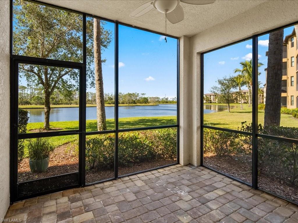 9719 Acqua Court, Unit 218 Naples, FL 34113 - Photo 21 of 23 Unfurnished sunroom featuring ceiling fan and a water view