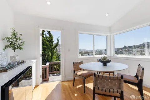 a view of a dining room with furniture window and outside view