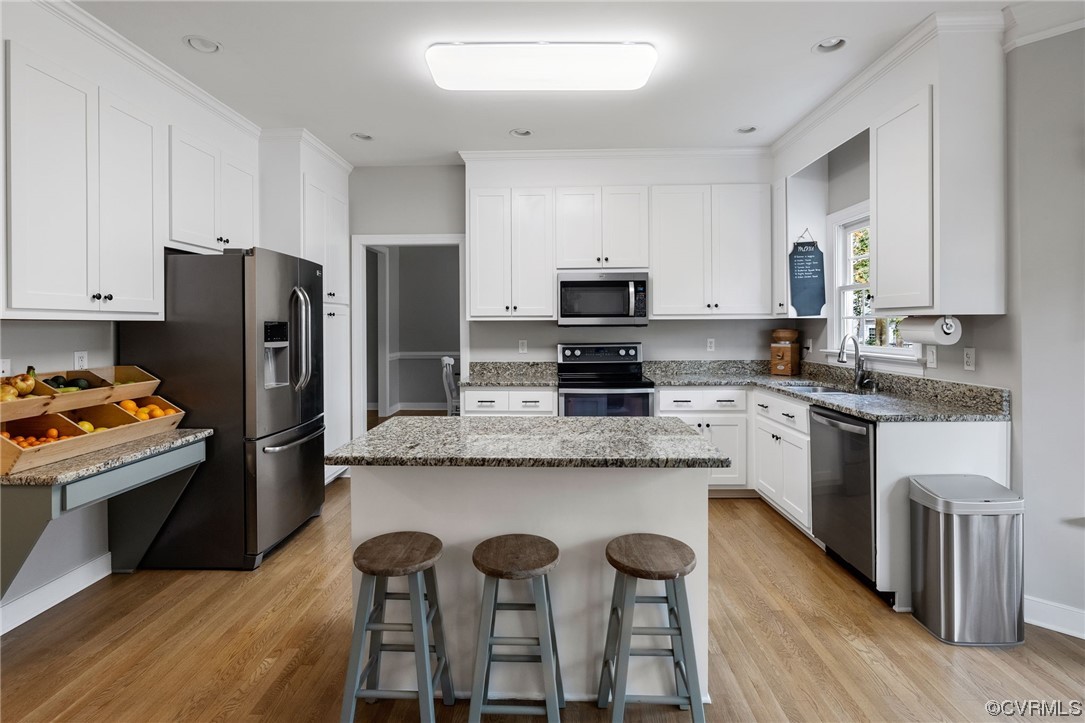820 Club Ridge Court Chester, VA 23836 - Photo 12 of 38 a kitchen with stainless steel appliances granite countertop a white cabinets and a refrigerator