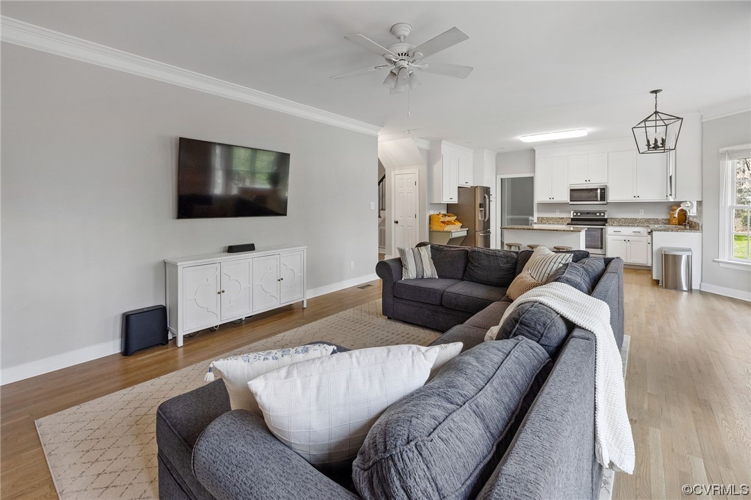 820 Club Ridge Court Chester, VA 23836 - Photo 16 of 38 a living room with furniture and a flat screen tv