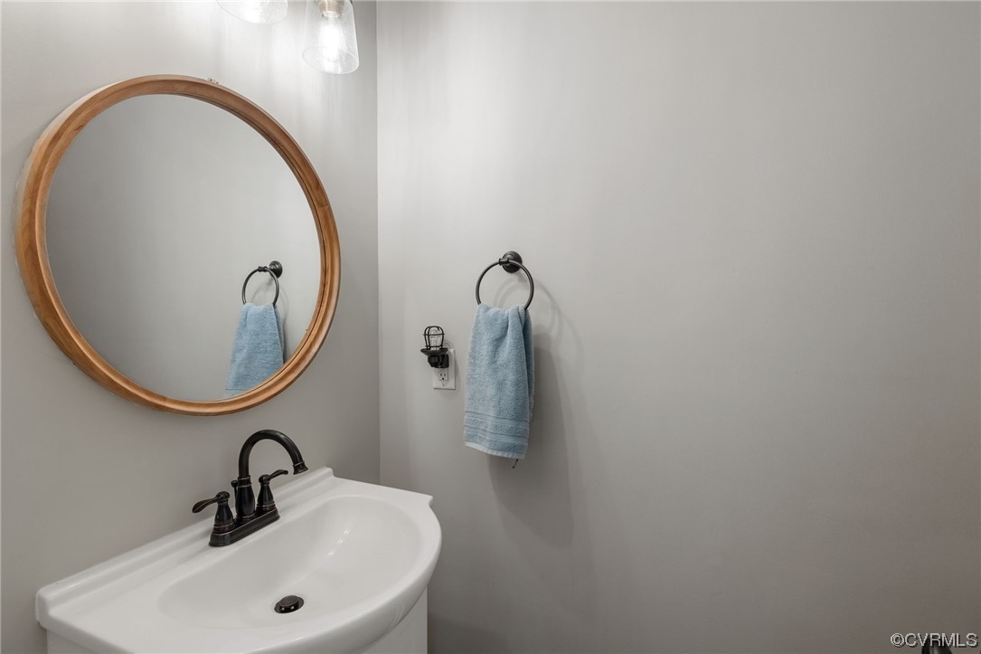 820 Club Ridge Court Chester, VA 23836 - Photo 18 of 38 a bathroom with a sink and mirror