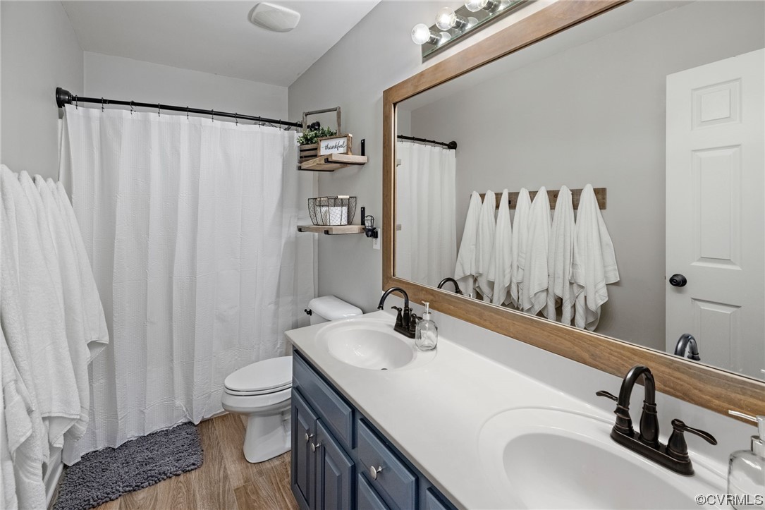 820 Club Ridge Court Chester, VA 23836 - Photo 20 of 38 a bathroom with a sink toilet and shower