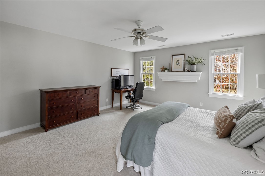 820 Club Ridge Court Chester, VA 23836 - Photo 25 of 38 a bedroom with a bed and a chandelier