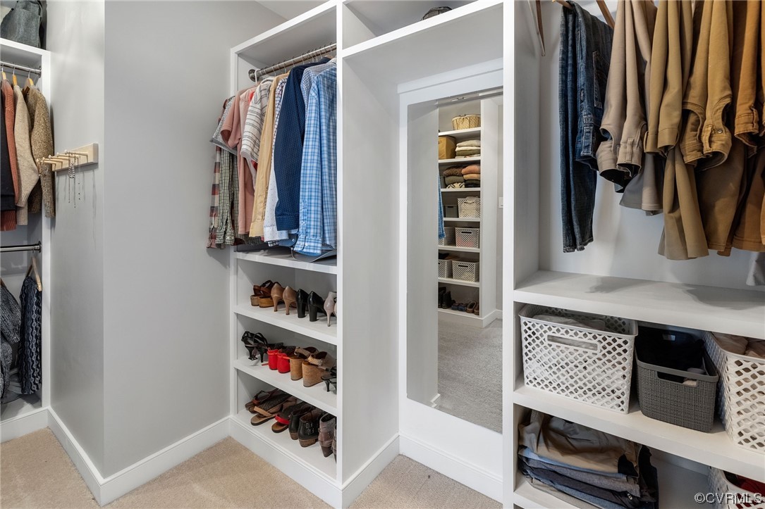 820 Club Ridge Court Chester, VA 23836 - Photo 28 of 38 a view of walk in closet with clothes and shoes