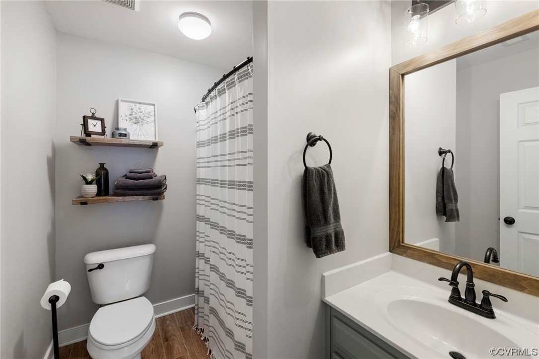 820 Club Ridge Court Chester, VA 23836 - Photo 31 of 38 a bathroom with a toilet sink and shower