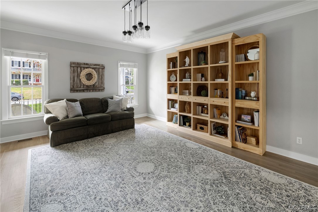 820 Club Ridge Court Chester, VA 23836 - Photo 7 of 38 a living room with a couch and a bookshelf