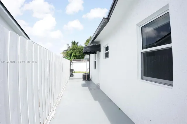a hallway with a door and a hallway
