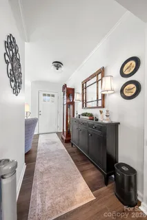 a view of living room with furniture and a window