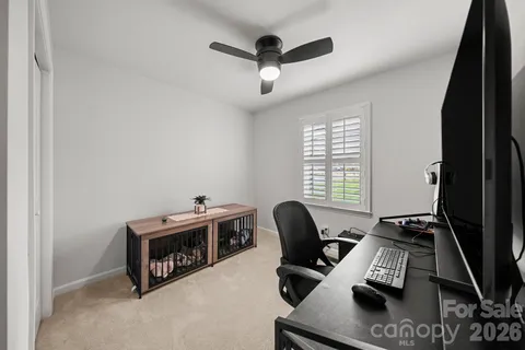 a view of workspace with windows recliner chair