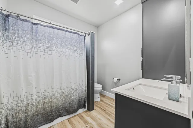 a bathroom with a sink and shower