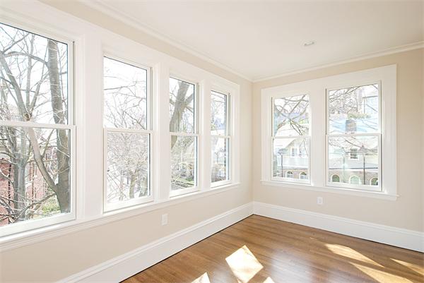 34 Rawson Road, Unit 2 Brookline, MA 02445 - Photo 11 of 24 a view of an empty room with wooden floor and a window