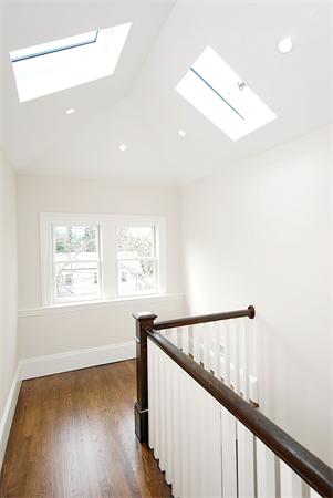 34 Rawson Road, Unit 2 Brookline, MA 02445 - Photo 15 of 24 a view of hallway with window and wooden floor