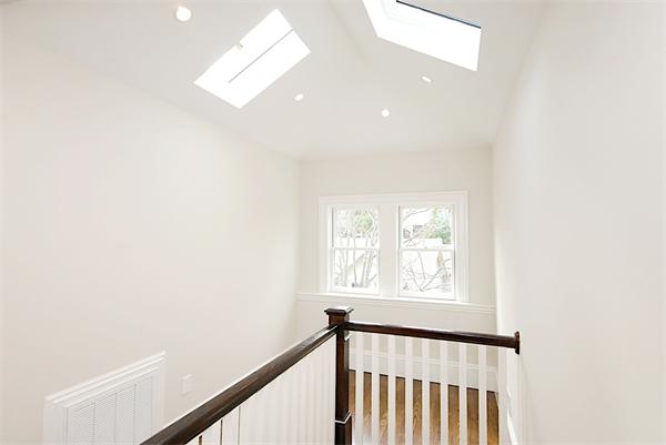 34 Rawson Road, Unit 2 Brookline, MA 02445 - Photo 16 of 24 a view of a hallway with windows