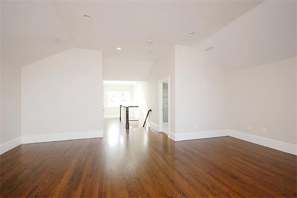 34 Rawson Road, Unit 2 Brookline, MA 02445 - Photo 17 of 24 a view of an empty room with wooden floor