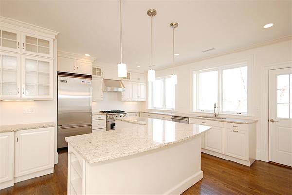 34 Rawson Road, Unit 2 Brookline, MA 02445 - Photo 6 of 24 a kitchen with stainless steel appliances granite countertop a sink a stove and refrigerator