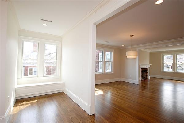 34 Rawson Road, Unit 2 Brookline, MA 02445 - Photo 7 of 24 a view of an empty room with wooden floor and a window