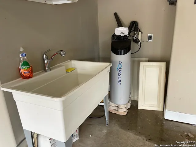 a bathroom with a sink and mirror