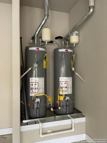 a kitchen with stainless steel appliances white cabinets and a refrigerator