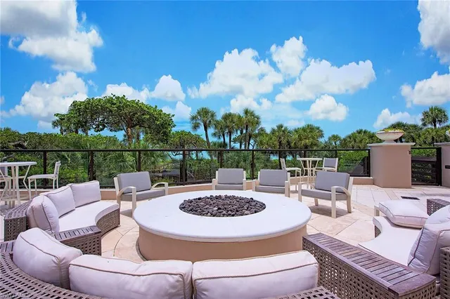 a view of a patio with couches chairs