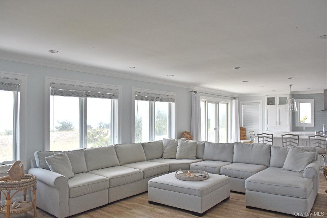 561 Dune Road Westhampton, NY 11978 - Photo 3 of 8 a living room with furniture and a large window