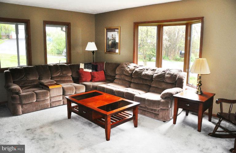 140 Holiday Road Cross Junction, VA 22625 - Photo 11 of 30 a living room with furniture and a large window