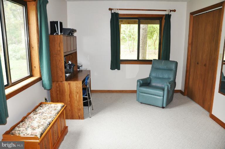 140 Holiday Road Cross Junction, VA 22625 - Photo 20 of 30 a living room with furniture and a window