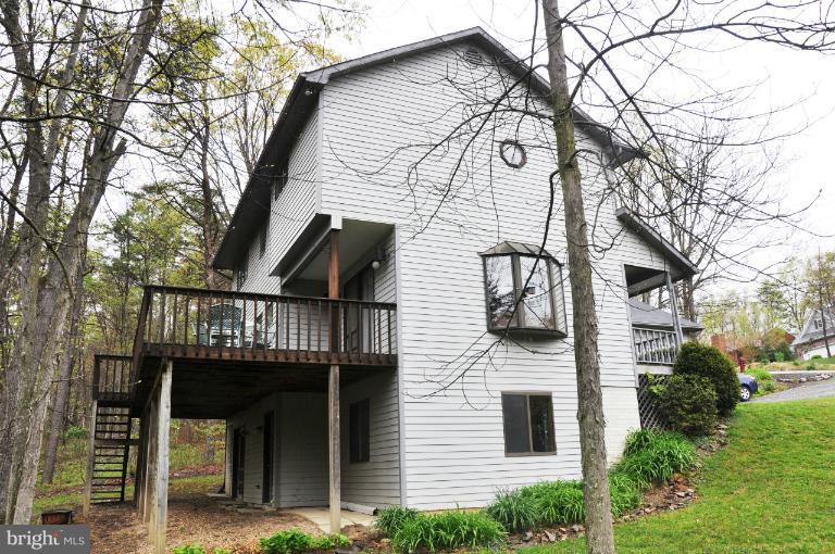 140 Holiday Road Cross Junction, VA 22625 - Photo 3 of 30 a front view of a house with balcony