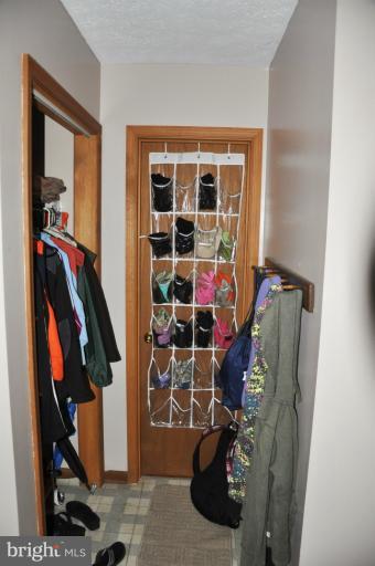 140 Holiday Road Cross Junction, VA 22625 - Photo 27 of 30 a view of walk in closet with clothes and shoes