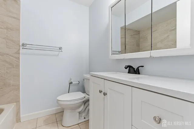 a view of a hallway with washer and dryer