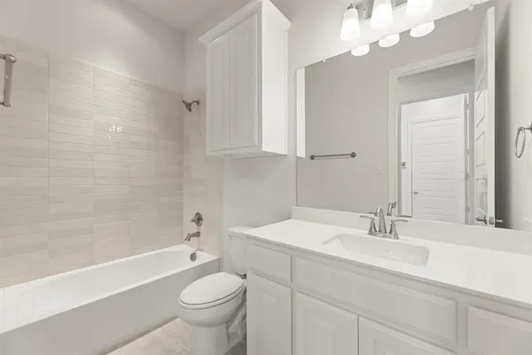 a bathroom with a sink a toilet and a bathtub
