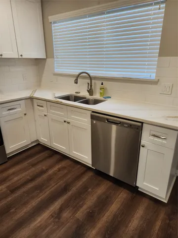 a view of a house with a yard and garage
