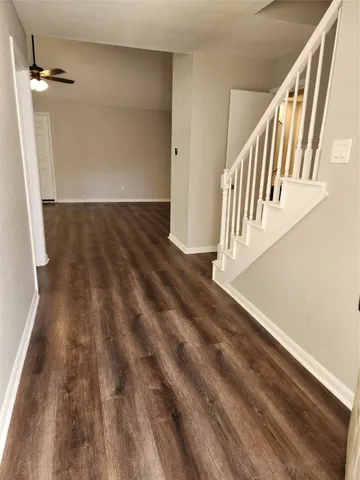 a bathroom with a bathtub and a window
