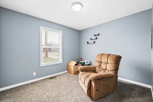 a room with furniture and a window