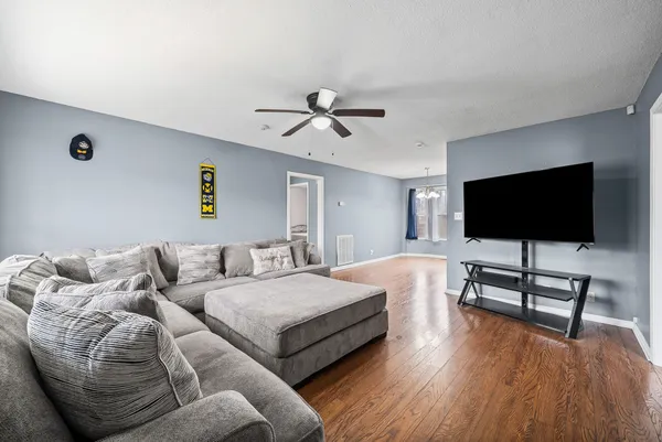 a living room with furniture and a flat screen tv