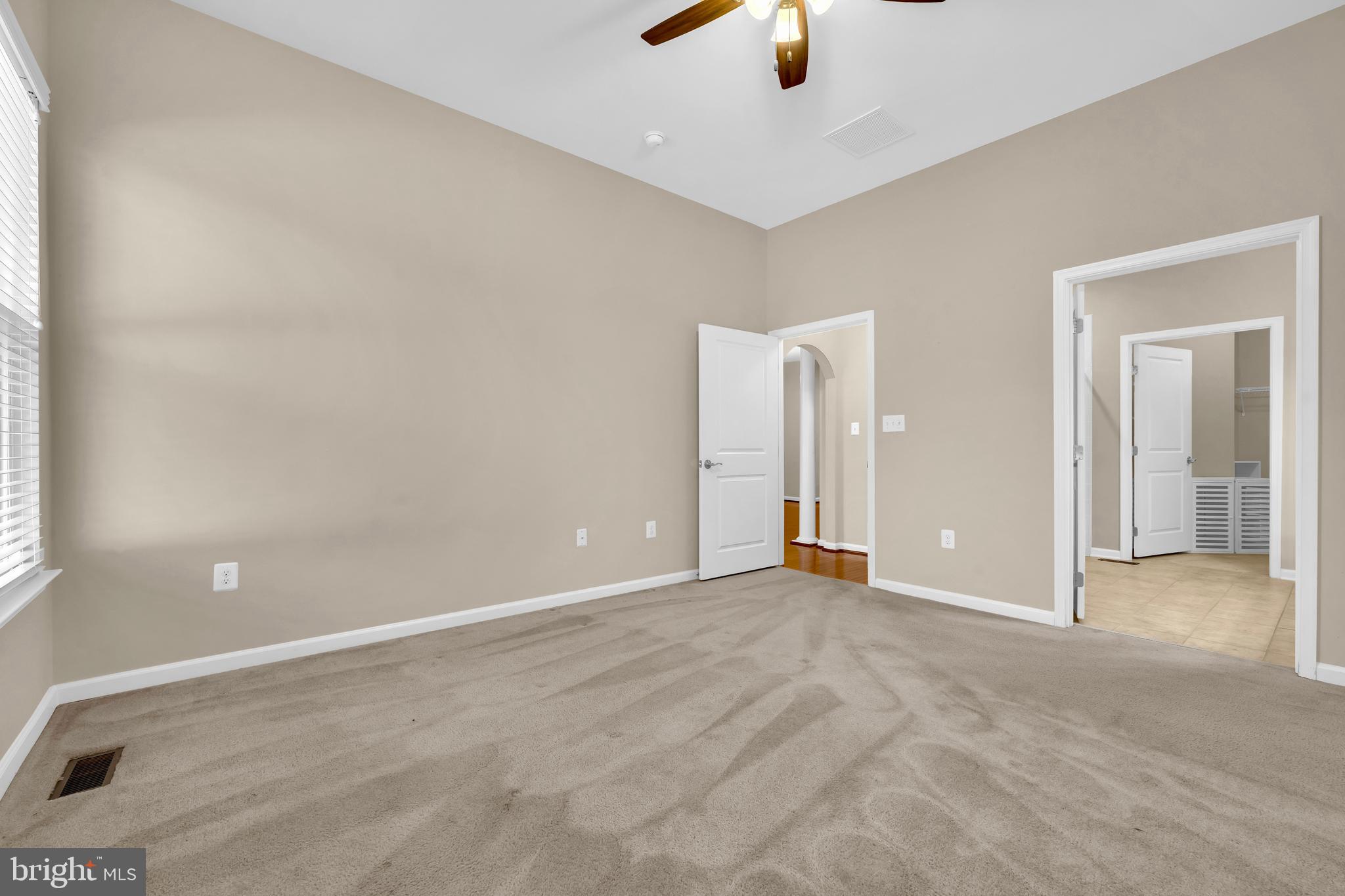 41663 McMonagle Square Aldie, VA 20105 - Photo 20 of 50 an empty room with fan and entrance