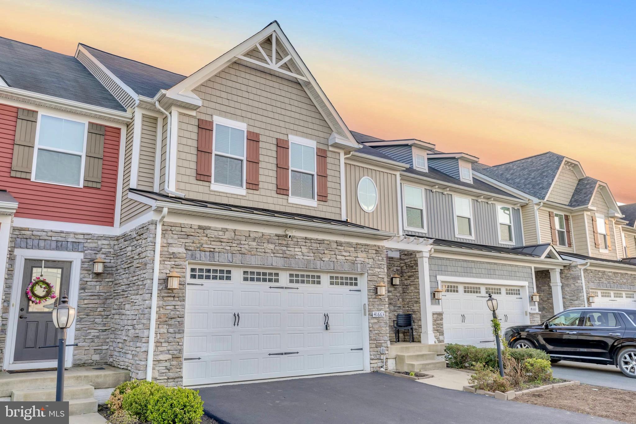41663 McMonagle Square Aldie, VA 20105 - Photo 2 of 50 a view of a white building among the street